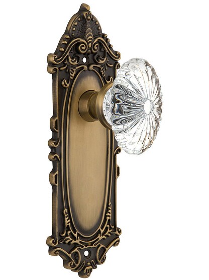 Victorian Plate with Oval Fluted Crystal Knob in Antique Brass with .
